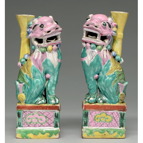 261 - Two Chinese polychrome dog of Fo censers, 19th c, the vivid green lion dog with pink head and green ... 