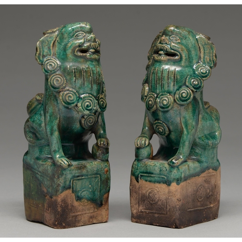 263 - A pair of Chinese tileworks type glazed biscuit dog of Fo incense burners, probably early 20th c, 23... 