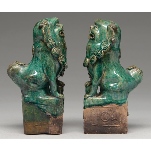 263 - A pair of Chinese tileworks type glazed biscuit dog of Fo incense burners, probably early 20th c, 23... 