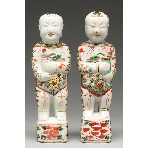 265 - Two Chinese famille verte figures of boys, Kangxi period, holding a pot of lotus, 27.5 and 28cm h... 