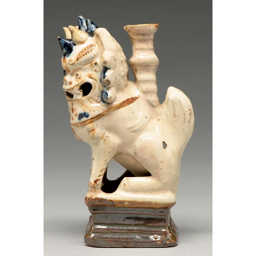 270 - A Chinese cream, cobalt and manganese glazed tileworks dog of Fo incense burner, 18th c, 16cm h... 