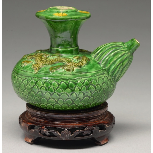 272 - A Chinese green glazed biscuit kendi, Ming dynasty, the shoulder moulded with dragons, the flared ne... 