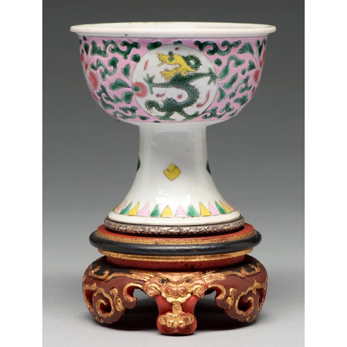 273 - A Chinese famille rose stem cup, the bowl enamelled with dragon roundels and peonies on a pink groun... 