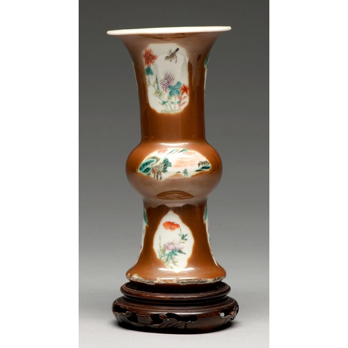 279 - A Chinese cafe au lait ground vase of archaic gu form, 19th c, enamelled with leaf and fan shaped la... 