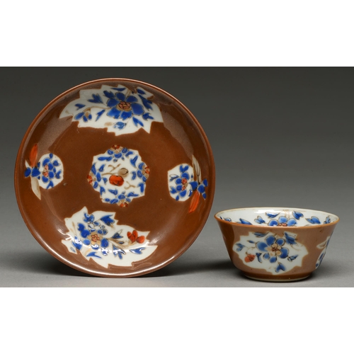 298 - A Chinese Batavian ware tea bowl and saucer, 18th c, enamelled and gilt with leaf or fruit shaped re... 