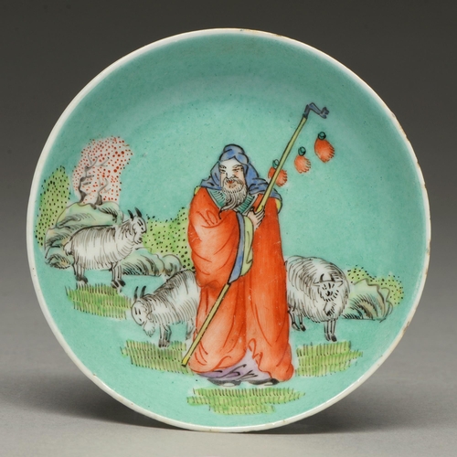 304 - A Chinese turquoise ground dish, late 19th c, painted with a sage and sheep, 95mm diam, Guangzhou ma... 