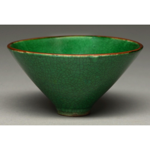 308 - A Chinese vivid green glazed biscuit conical bowl, 19th/20th c, with brown rim, the crackled glaze t... 