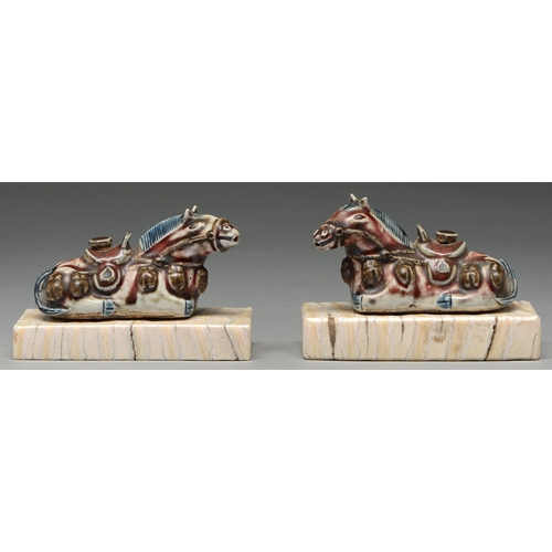 309 - A pair of Chinese blue, white and manganese water droppers and stoppers in the form of horses, 18th ... 