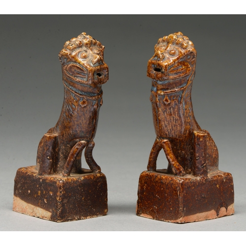 315 - A pair of Chinese brown glazed earthenware dog of Fo incense stands, Ming Dynasty, the high temperat... 