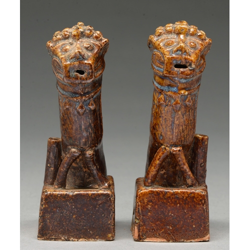 315 - A pair of Chinese brown glazed earthenware dog of Fo incense stands, Ming Dynasty, the high temperat... 