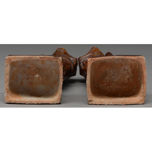 315 - A pair of Chinese brown glazed earthenware dog of Fo incense stands, Ming Dynasty, the high temperat... 