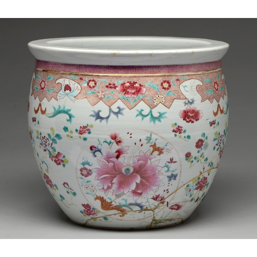 316 - A Chinese famille rose fish bowl, 18th / 19th c, painted with lotus and peonies, the lotus shaped bo... 