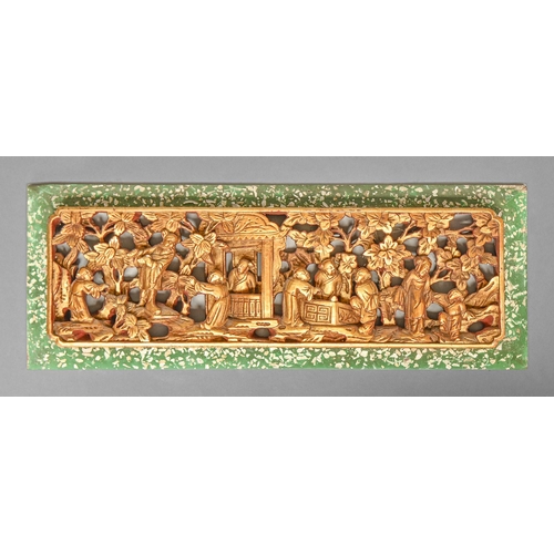 319 - A Chinese carved and pierced gilt lacquered wood relief, 20th c, in painted green and mother of pear... 