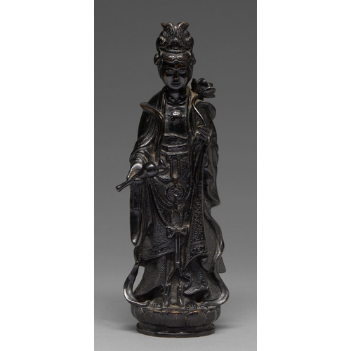 325 - A Chinese bronze figure of Guanyin, 19th c, a lotus and flask in her hands, on lotus base, 32cm h... 