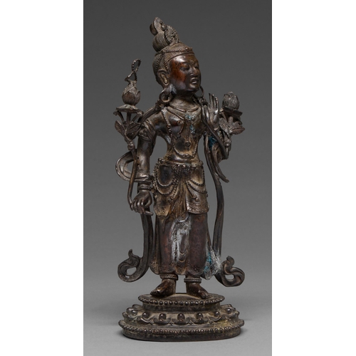 327 - A Tibetan bronze figure of Guanyin, 19th c, on lotus base, sealed, 26.5cm h