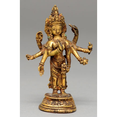 330 - A Tibetan miniature gilt bronze figure of  Vasudhara (Tara), 19th c, sealed, 10cm h