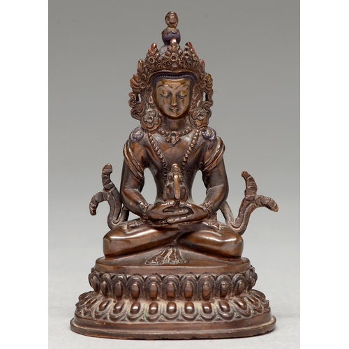 331 - A Tibetan bronze figure of Guanyin 20th c, on double lotus base, sealed, 10cm h