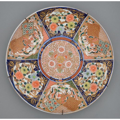 355 - An Imari dish, early 20th c, decorated to the centre with kiku and gilt karakusa scrolls in panelled... 