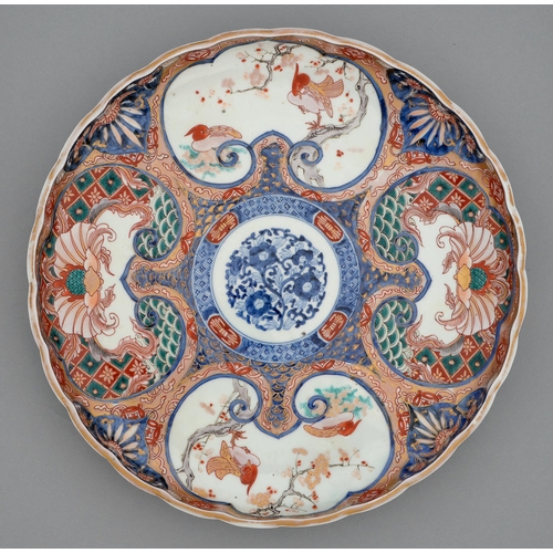 356 - An Imari tray, Meiji period, painted in underglaze blue with a central floral medallion in diaper su... 