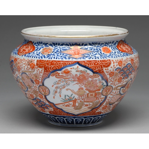 357 - An Imari jardiniere, early 20th c, painted in underglaze blue and enamelled in red and gilt with a r... 