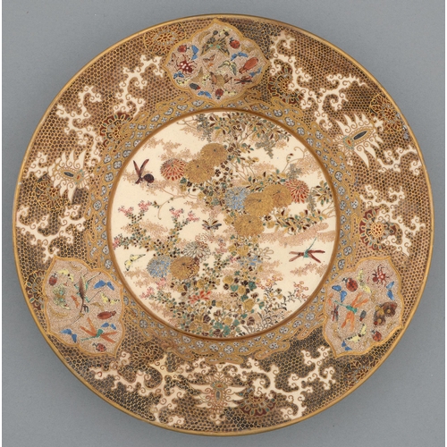 366 - A Satsuma ware plate, Meiji period, enamelled and gilt with chrysanthemums and insects in wide gilt ... 