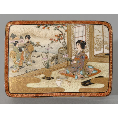 367 - A Satsuma ware box and cover, Meiji period, the cover enamelled with a woman in an interior arrangin... 