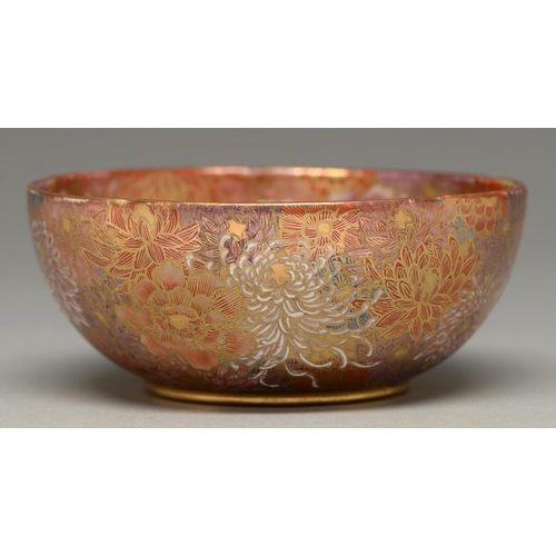 369 - A Satsuma ware bowl, early 20th c, enamelled with chrysanthemums and peony on a firey red ground, 15... 