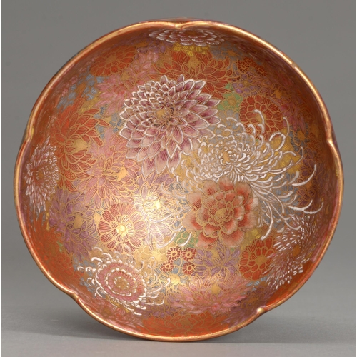 369 - A Satsuma ware bowl, early 20th c, enamelled with chrysanthemums and peony on a firey red ground, 15... 