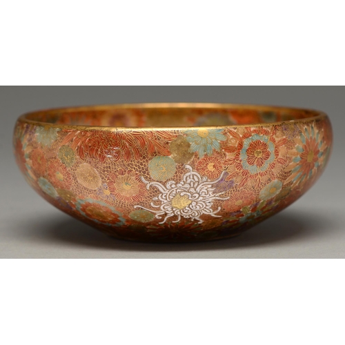 370 - A Satsuma ware bowl, early 20th c, of rounded form and enamelled and gilt with densely packed flower... 