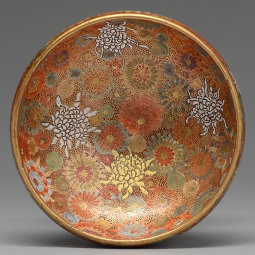 370 - A Satsuma ware bowl, early 20th c, of rounded form and enamelled and gilt with densely packed flower... 