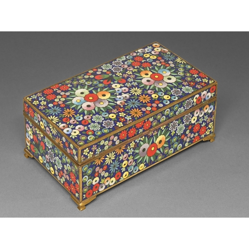 391 - A Japanese cloisonne enamel box, second quarter 20th c, enamelled with brighlty colourerd stylised f... 