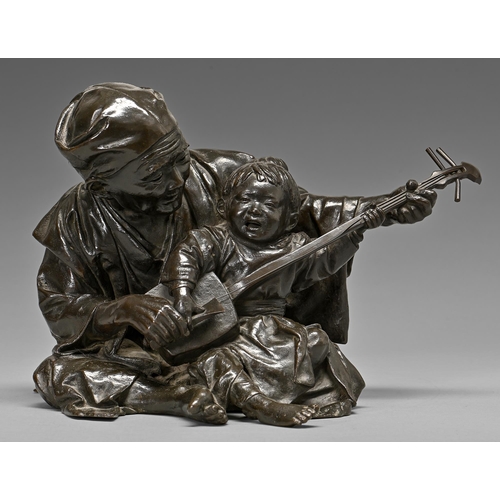 403 - A Japanese bronze sculpture of a father teaching his son to play the shamisen, Meiji period, rich da... 