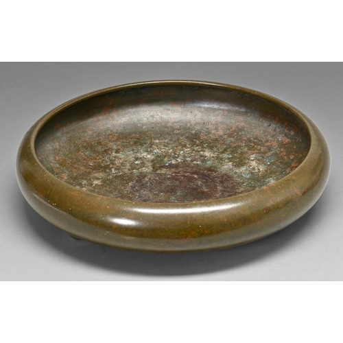 407 - A Japanese bronze flower arrangement  bowl, Meiji period, of shallow rounded form with inverted rim ... 