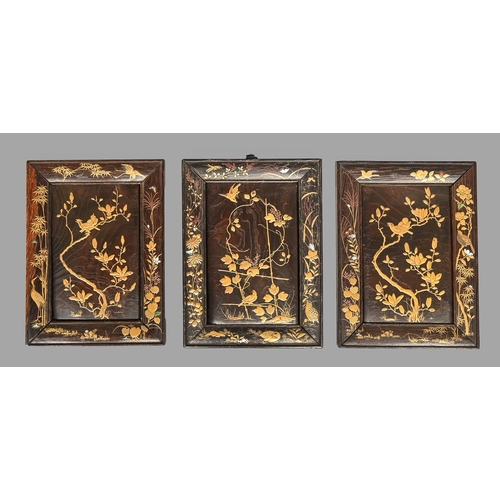 408 - A set of three Japanese lacquered wood panels, Meiji period, decorated in gold lacquer and coloured ... 