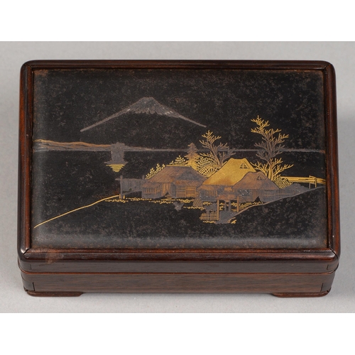 409 - A Japanese wood and mixed metals box and cover, Taisho period, the cover inset with inlaid bronze la... 