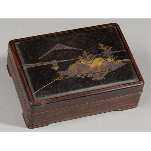 409 - A Japanese wood and mixed metals box and cover, Taisho period, the cover inset with inlaid bronze la... 