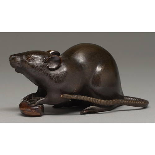 435 - A Japanese bronze okimono of a rat, Meiji period, with finely chiselled fur, the rodent's fore paws ... 