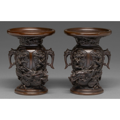 436 - A pair of Japanese bronze dragon and phoenix vases, Meiji period, with high relief cast and applied ... 