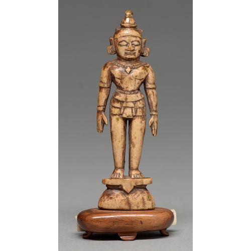 442 - An Indian carved bone miniature devotional statuette, possibly 16th / 17th c, 11.5cm h, affixed late... 