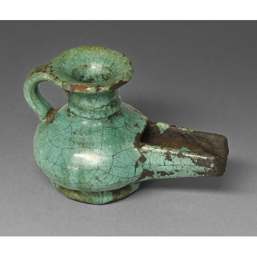 454 - A Persian turquoise glazed pottery oil lamp, Safavid dynasty, 68mm h  Provenance: Cotterill Collecti... 