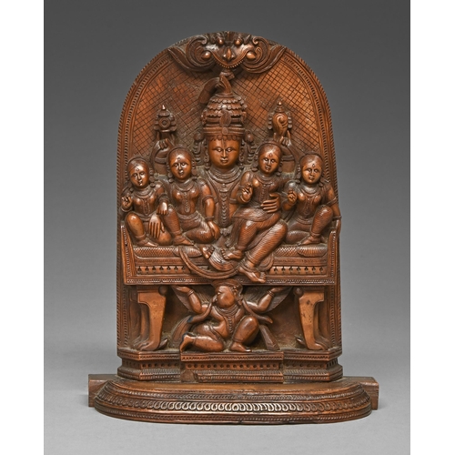 456 - An Indian sandalwood carving of Shiva Parivar, 19th c, 21.5cm h