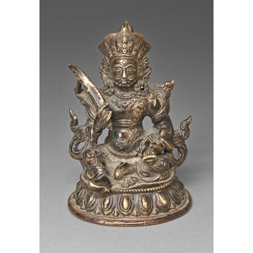 462 - A Sino-Tibetan bronze sculpture of a guardian, on lotus base, sealed, 11cm h