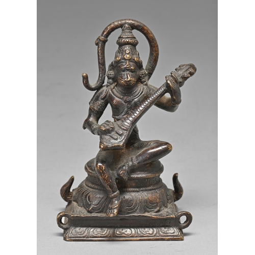 463 - An Indian bronze sculpture of Hanuman, playing the guitar, 15cm h