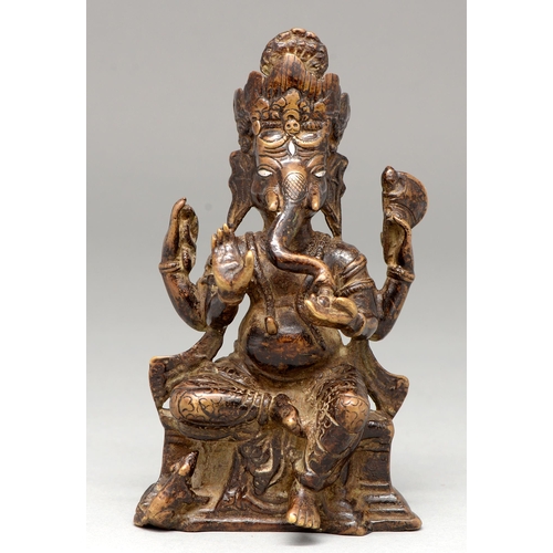 467 - An Indian bronze sculpture of Ganesha, 17th - 18th c, with silver eyes, 16cm h