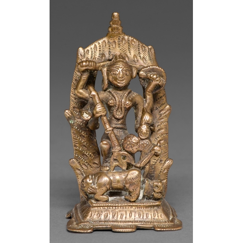 468 - An Indian brass sculpture of Durga slaying the bull demon, 90mm h