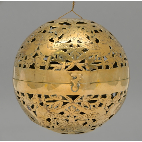 473 - A Persian brass shadow sphere, late 19th c, pierced and engraved with birds and flowers, the two hem... 