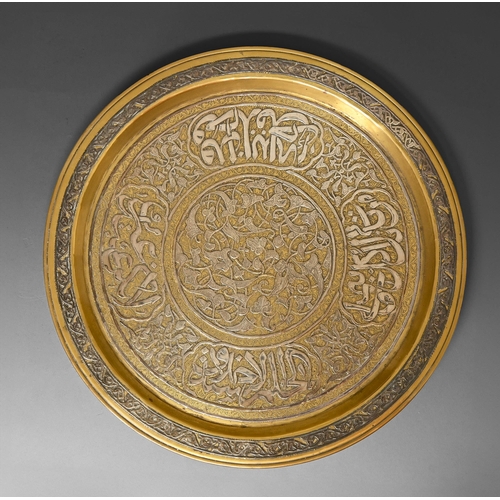 474 - A brass Cairo ware dish, Egypt or Syria, 19th / early 20th c, with applied silver decoration and cal... 