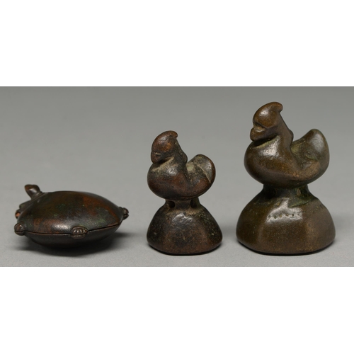 476 - A  bronze opium weight in the form of a hintha bird, Burma, 19th c, 62mm h, another, smaller and a t... 