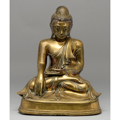 477 - A bronze sculpture of Buddha, Burma, 19th c, with glass eyes and coloured glass detail, 38cm h... 