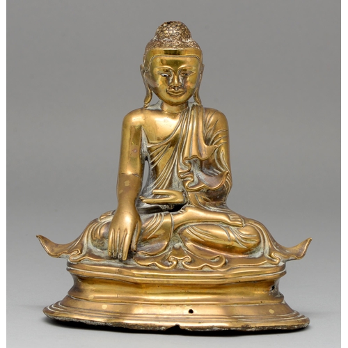 478 - A brass sculpture of Buddha, Mandalay, Burma, 19th c, with glass eyes, 21cm h